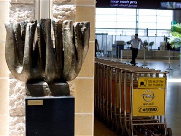 A bronze sculpture of a Menorah, by Chaim Ragine